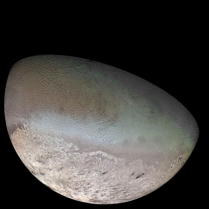 Image of Triton, Neptune's largest moon, displaying a rugged surface with varying colors and textures, including light and dark patches